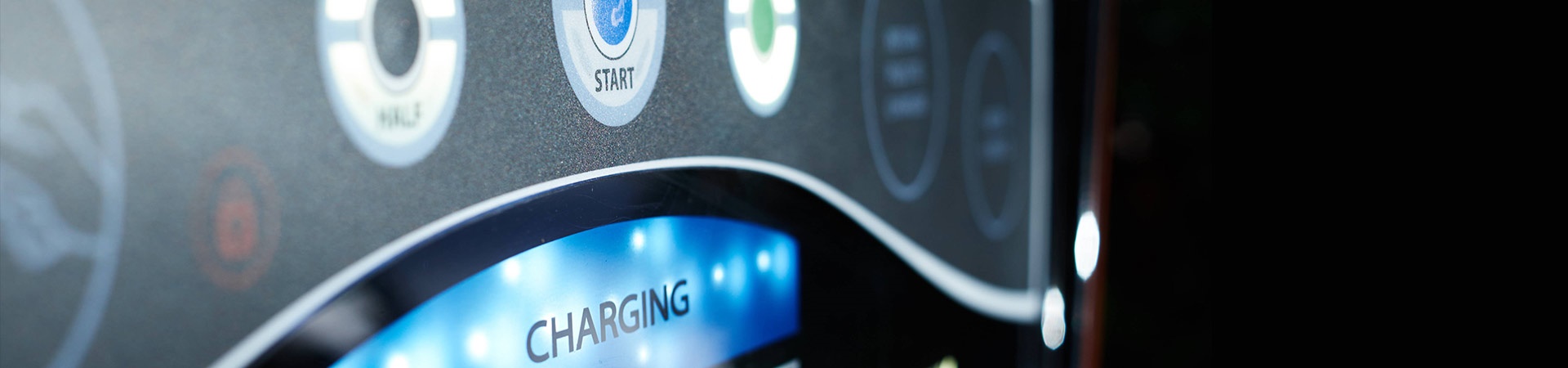 Electric vehicle dashboard that shows the Start button and the word Charging
