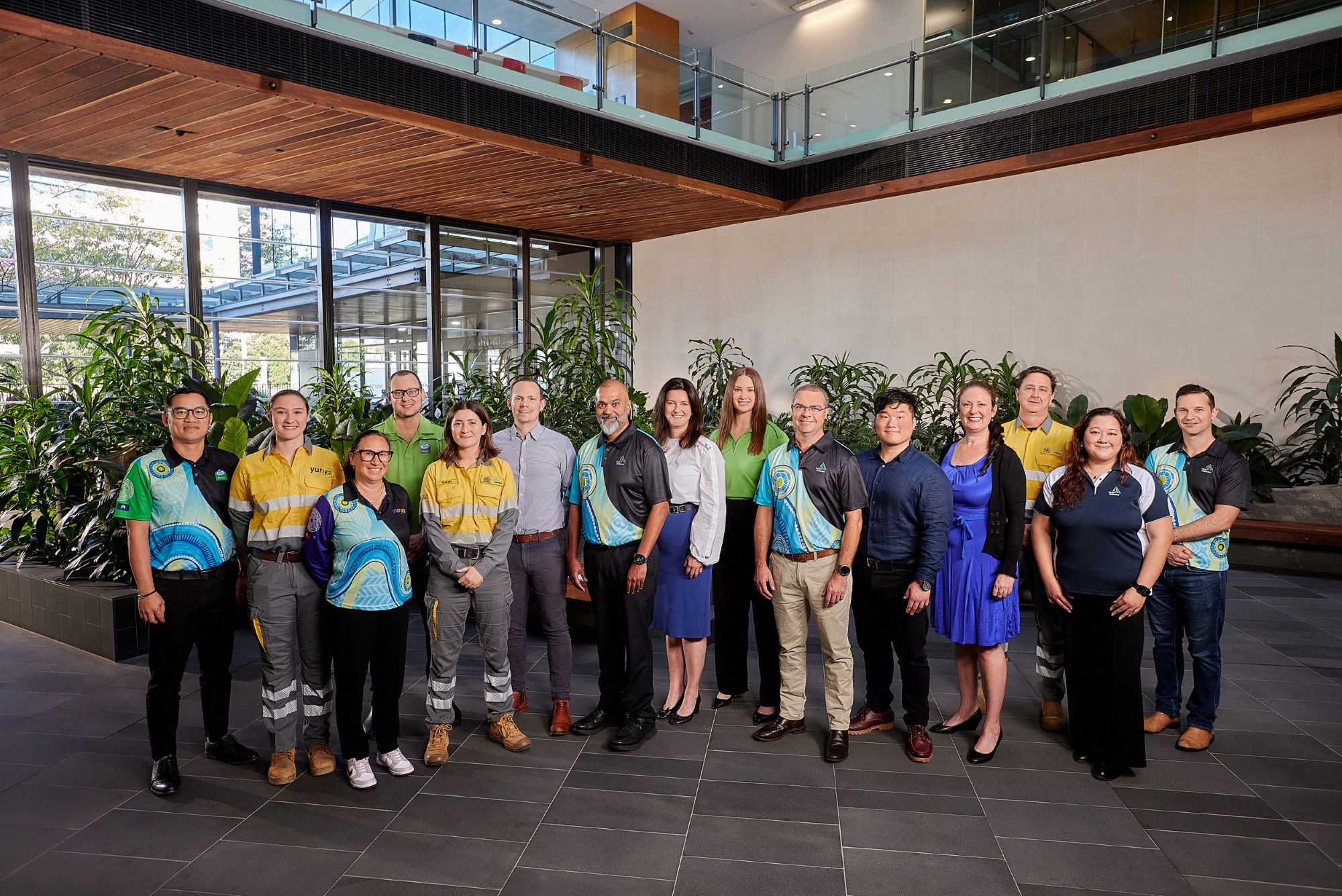 A group of Energy Queensland employees in the foyer