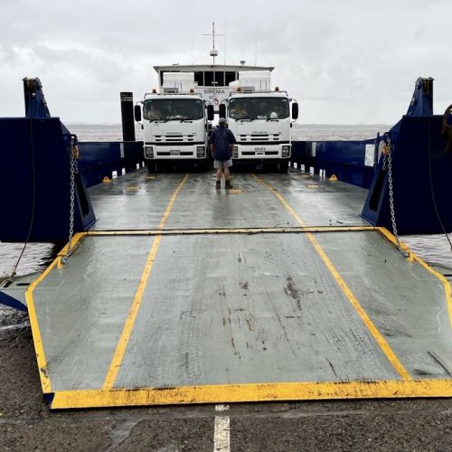 Work vehicles on a water ferry