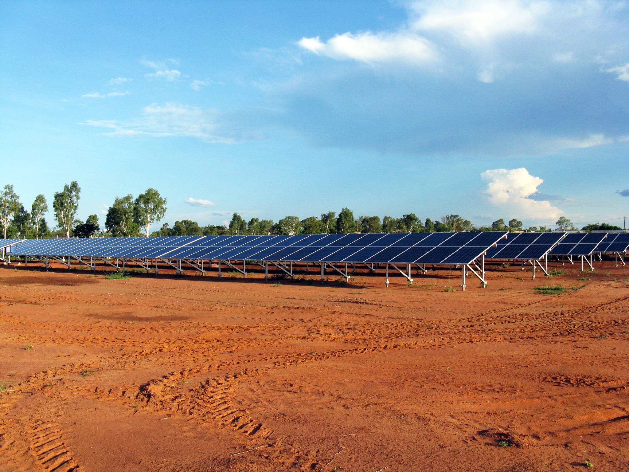 Large number of solar panels in a paddock called a solar farm